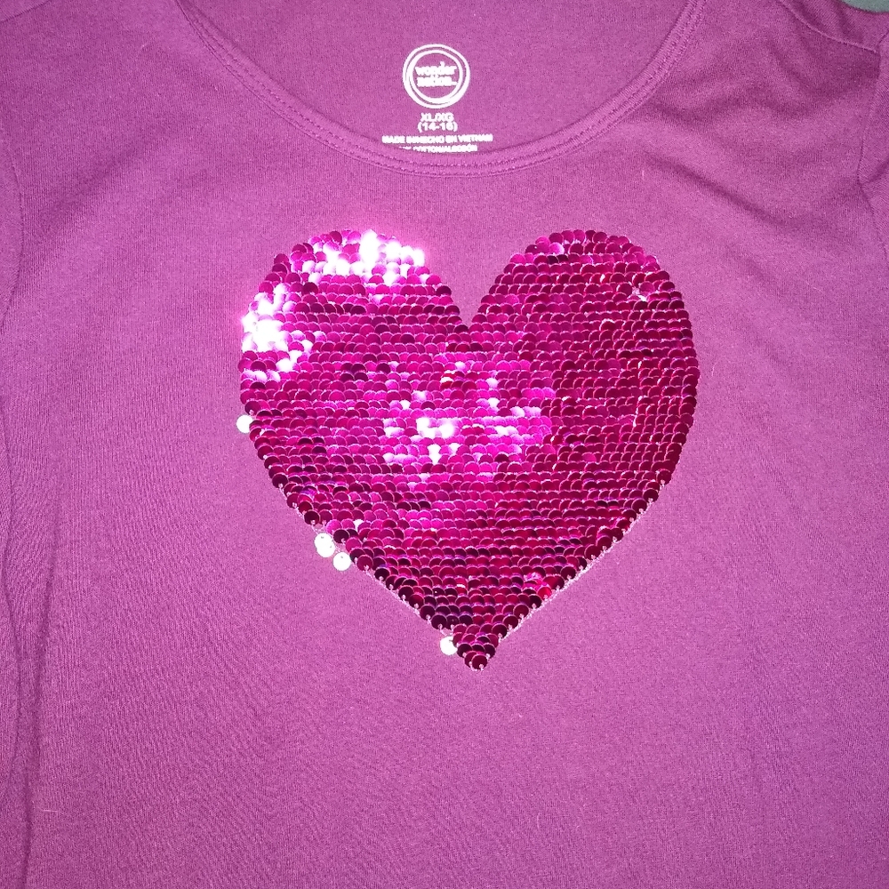 Purple long sleeve shirt with sequence heart.